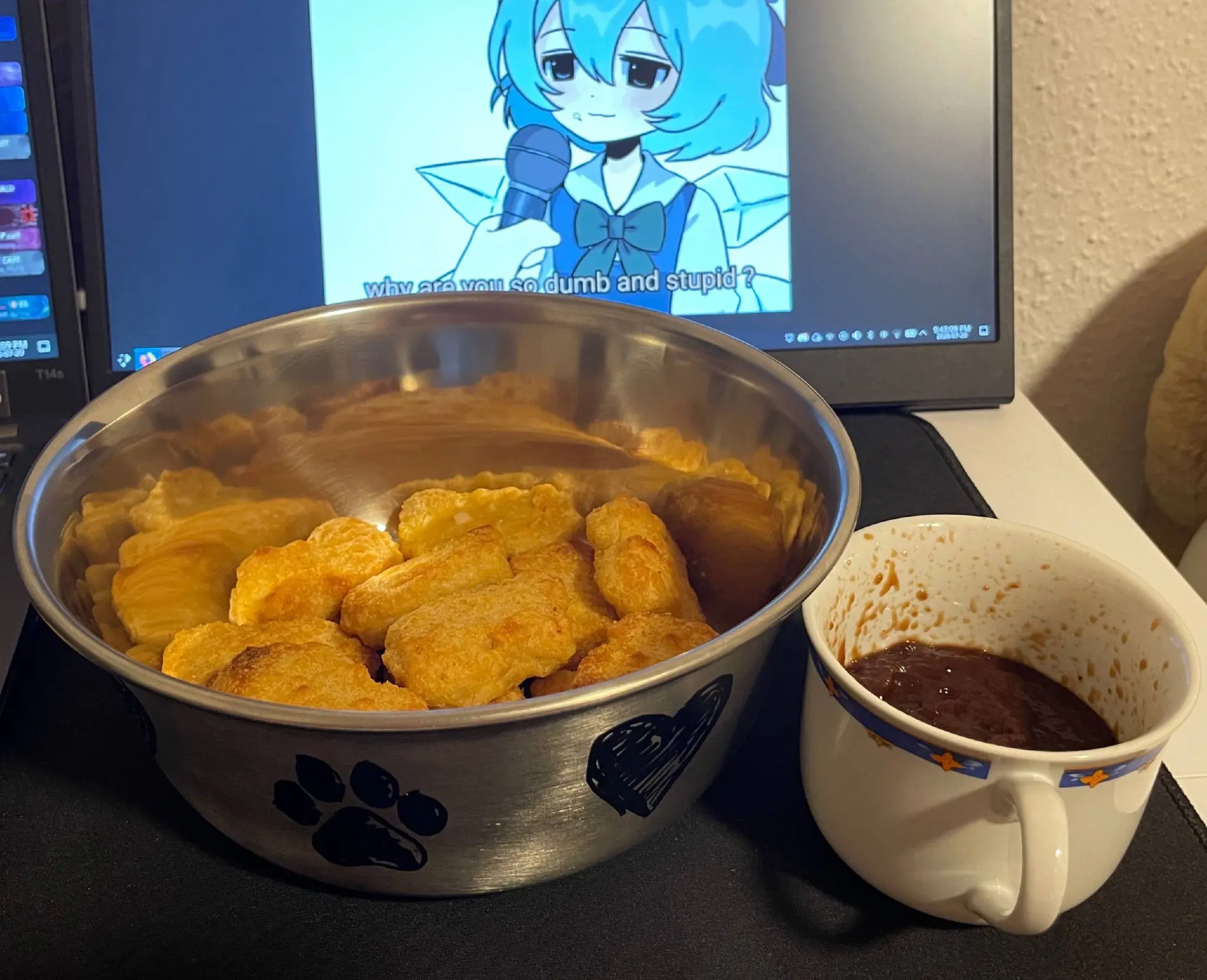a metal dog bowl full of chicken nuggets and an espresso mug full of bbq sauce in front of a laptop screen with a picture on it that says "why are you so dumb and stupid" to cirno touhou a metal dog bowl full of chicken nuggets and an espresso mug full of bbq sauce in front of a laptop screen with a picture on it that says "why are you so dumb and stupid" to cirno touhou